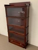 A four tier globe Wernicke mahogany barrister bookcase with glazed doors and decorative mouldings