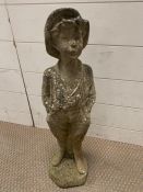 A garden statue of a little boy 60 cm high