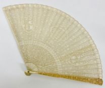 An Antique ivory fan, with Chinese design in a silk lined box.