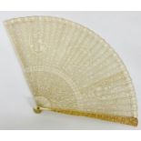 An Antique ivory fan, with Chinese design in a silk lined box.
