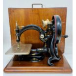 A Willox & Gibbs sewing machine in pine box (Being sold on behalf of the Salvation Army)
