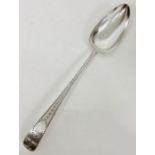 An Irish silver serving spoon, dated 1800 with makers mark JS (32cm in length)