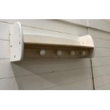 A four hook wall shelf by Pin (82 cm w x 18cm d x 26cm h)