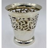 A silver vase, with pierced decoration (74g) hallmarked by William Devenport Birmingham 1902.