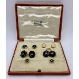 A part set of 18ct and 9ct cuff links and shirt stud set with inset diamonds.