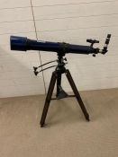 A Meade instruments model 312 telescope blue on stand