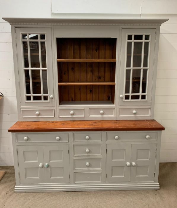 A Substantial painted Welsh Dresser with glazed cabinets, open shelves, drawers and cupboards