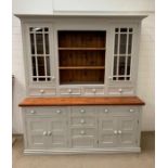 A Substantial painted Welsh Dresser with glazed cabinets, open shelves, drawers and cupboards