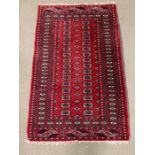 A Red Ground rug (W 95cm x L 150cm) Lined