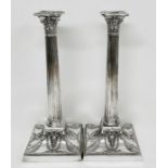 A Pair of quality Walker and Hall column silver plated candlesticks