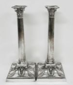 A Pair of quality Walker and Hall column silver plated candlesticks