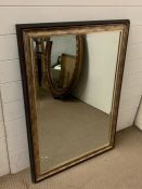 A contemporary wall mirror with a bronze effect frame (74cm x 107cm)