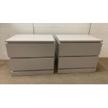 A pair of light grey bedsides with two soft closing drawers (H60cm W70cm D50cm)