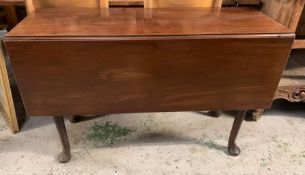 A mahogany serving table on pad feet (H72cm Sq110cm)