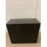 A black glass chest of drawers with faux shagreen chips to top and sides, working order (H88cm W90cm