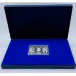 A Danbury Mint Silver Jubilee Post Office Commemorative stamp edition and silver ingot (73g)