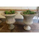 A pair of reclaimed pedestal garden urn planters (H70cm W60cm)
