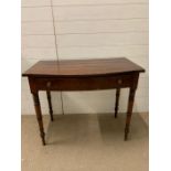 A mahogany hall table with string inlay and one drawer to centre on turned legs (H74cm W92cm D52cm)