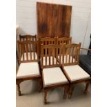 A hardwood dining table and six chairs