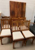 A hardwood dining table and six chairs