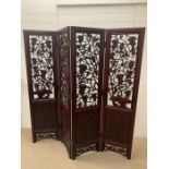 A Chinese rosewood four panelled screen with carved grapes and vines (Each panel 46cm x 184cm)