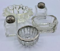 A selection of glass salts, various styles and one with a silver hallmarked rim.