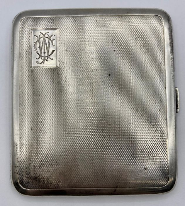 A Silver cigarette case by JHW and hallmarked for Birmingham 1948