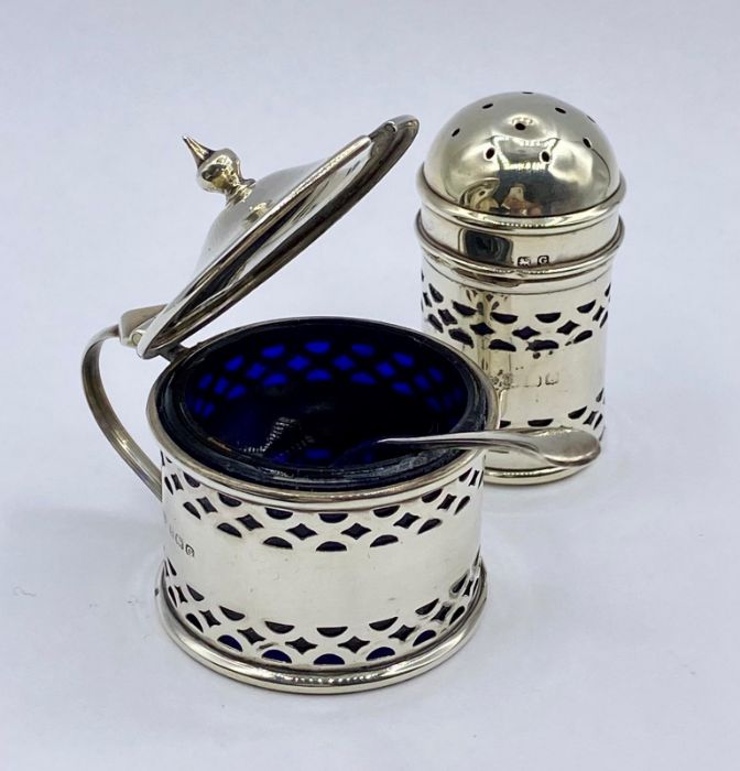 A cased cruet set with blue glass liners by John Rose, Birmingham 1931 - Image 2 of 3