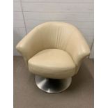 A contemporary leather tub chair on chrome swirl base