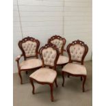 Four carved dining chairs with button backs