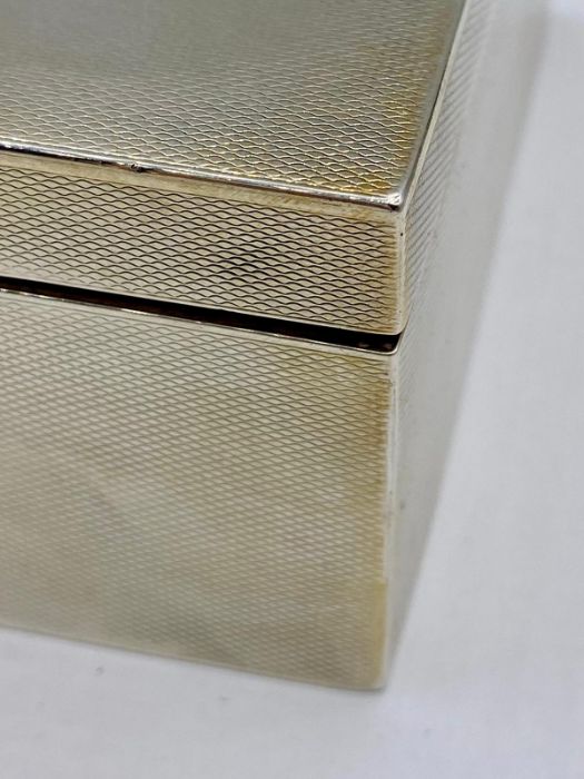 A silver cigarette box by Asprey, hallmarked for Chester 1917. - Image 3 of 6