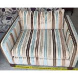 A one seater sofa made by Sofawork Shop, with a hardwood frame and striped upholstery.