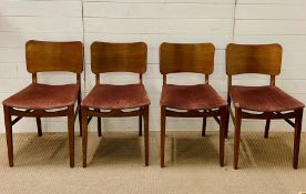 A set of four Beautility dining chairs