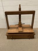 A wooden book/plate press with drawer under (H64cm W65cm D41cm)