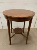 A mahogany lamp table with inlay rim and tapering legs (H74cm Dia60cm)