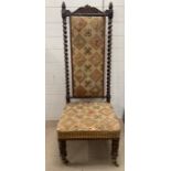 A Victorian Prie-Dieu or Hall chair with carved top rail and turned barley twist supports and an