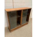 A glazed front bookcase (H82cm W100cm D27cm)