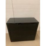 A black glass chest of drawers with faux shagreen chips to top and sides, working order (H88cm W90cm