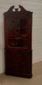A mahogany corner cabinet (H192cm W82cm D57cm)