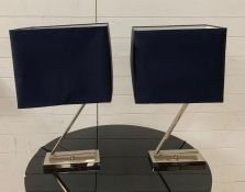 Two chrome Z form table lamps with blue shades