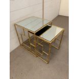 Two nesting mirrored side tables with gilt metal base (Largest 46cm x 40cm)