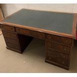 A pedestal partner's desk with leather top (H78cm W150cm D95cm)