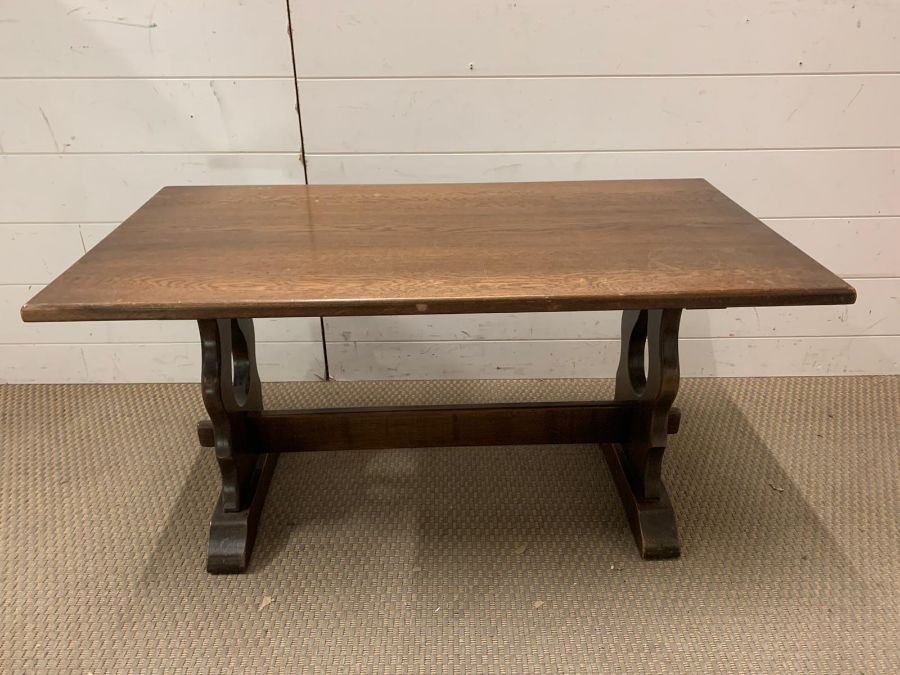 An oak coffee table with peg sides by J.C (H46cm W90cm D46cm)