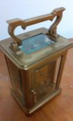 A brass and glass skeleton carriage clock, (10.5x8x6.5 cm).