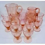 A selection of pink glass consisting of goblets and jugs