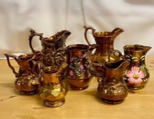 A selection of seven various lustre ware jugs.