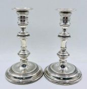 A Pair of silver candlesticks, hallmarked for London 1985, by M C Hersey & Son Ltd