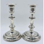 A Pair of silver candlesticks, hallmarked for London 1985, by M C Hersey & Son Ltd