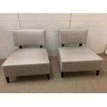 A pair of lounge/occasional contemporary chairs with square seats and curved backs (H82cm W80cm