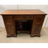 An inlaid desk with panelled front and brass handles (H82cm W115cm D55cm)